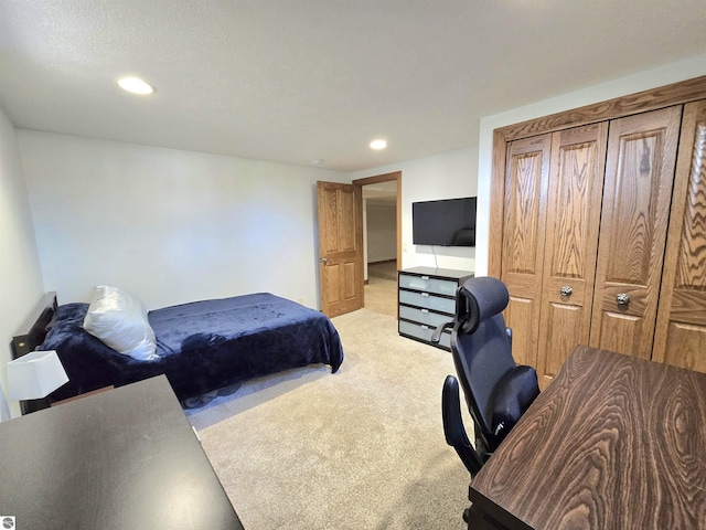 205 S Elm St, Suttons Bay, MI 49682 - bedroom with light colored carpet, recessed lighting, and a desk