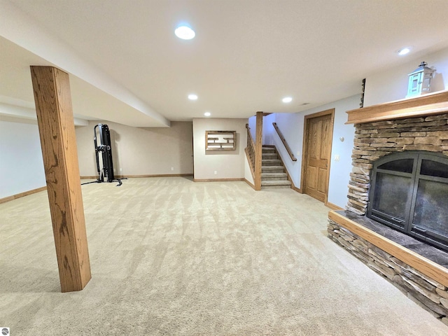 205 S Elm St, Suttons Bay, MI 49682 - unfurnished living room featuring carpet floors, a fireplace, recessed lighting, stairs, and baseboards