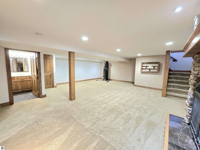 205 S Elm St, Suttons Bay, MI 49682 - finished basement with light carpet, recessed lighting, baseboards, and stairs
