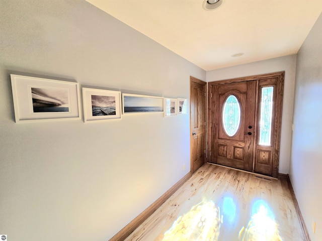 205 S Elm St, Suttons Bay, MI 49682 - entryway featuring light wood finished floors and baseboards