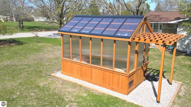 205 S Elm St, Suttons Bay, MI 49682 - view of greenhouse featuring a yard