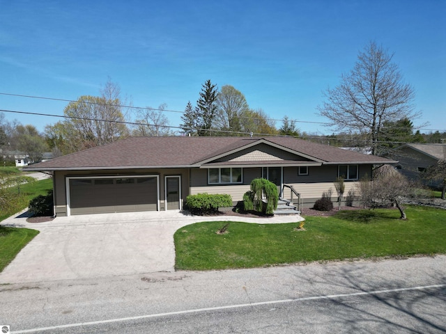 205 S Elm St, Suttons Bay, MI 49682 - ranch-style home with an attached garage, driveway, a front yard, and a shingled roof