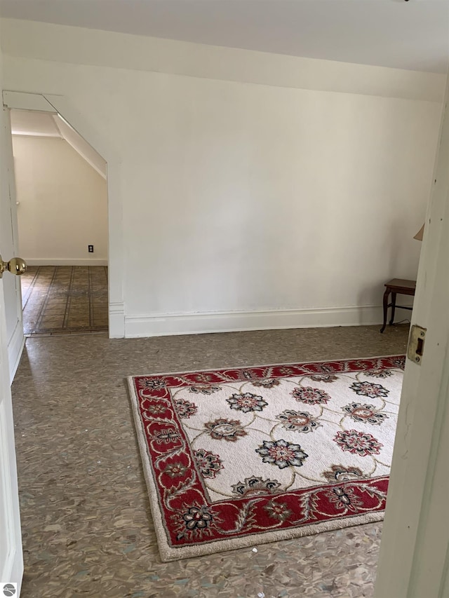 hall featuring baseboards