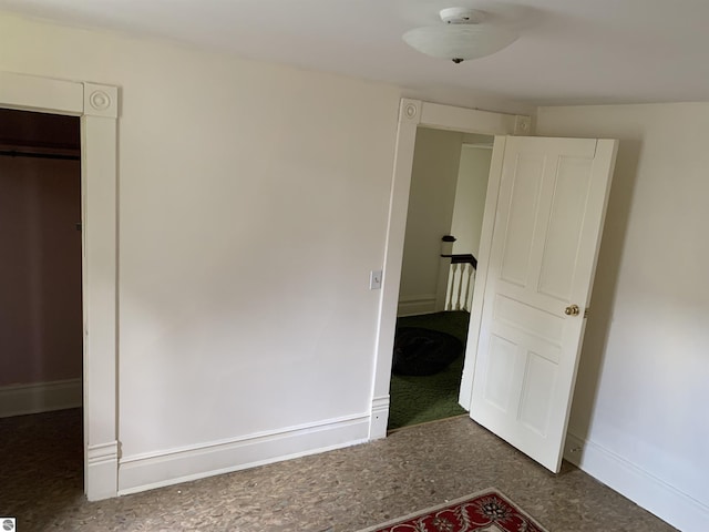 unfurnished bedroom with baseboards
