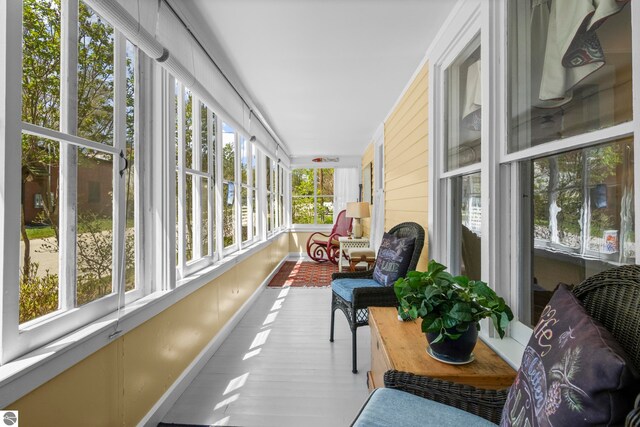 302 N Rose St, Northport, MI 49670 - sunroom / solarium with healthy amount of natural light, baseboards, and wood finished floors