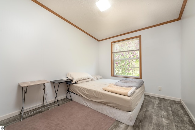 2250 N Coleman Rd, Coleman, MI 48618 - bedroom with crown molding, wood finished floors, lofted ceiling, and baseboards
