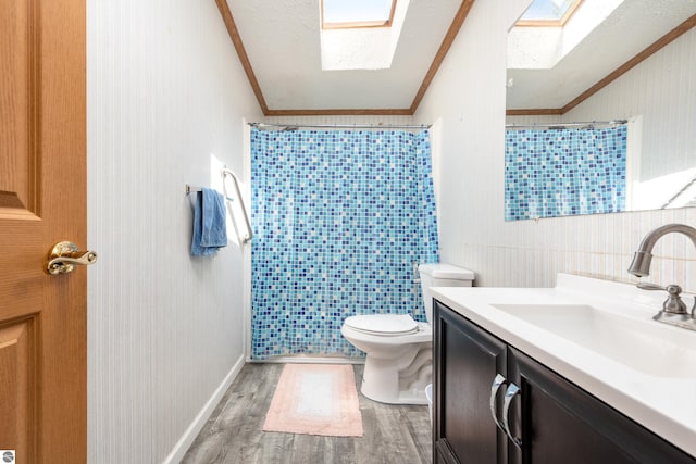 2250 N Coleman Rd, Coleman, MI 48618 - bathroom with ornamental molding, wood finished floors, a shower with shower curtain, toilet, and vanity