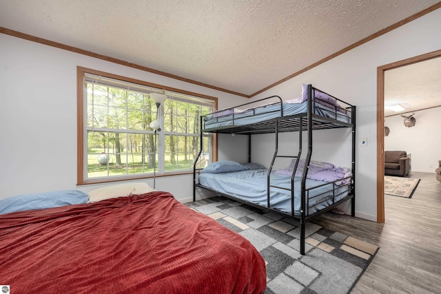 2250 N Coleman Rd, Coleman, MI 48618 - bedroom featuring a textured ceiling, wood finished floors, ornamental molding, and baseboards
