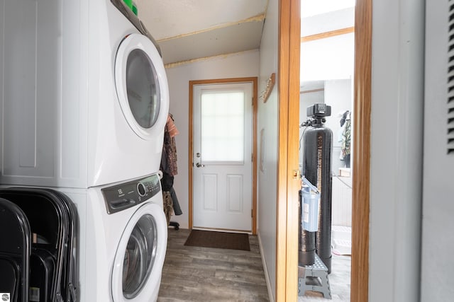 2250 N Coleman Rd, Coleman, MI 48618 - laundry room featuring stacked washer / dryer and wood finished floors