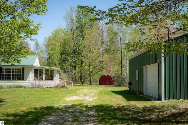 2250 N Coleman Rd, Coleman, MI 48618 - view of grassy yard featuring an outdoor structure