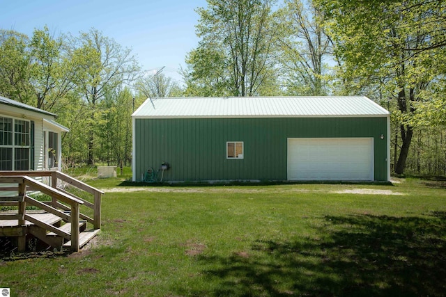 2250 N Coleman Rd, Coleman, MI 48618 - view of green lawn with an outdoor structure and a garage