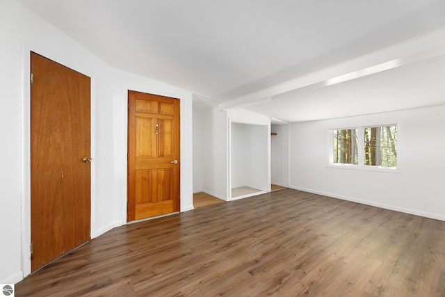 11199 Center Rd, Traverse City, MI 49686 - spare room featuring wood finished floors and baseboards