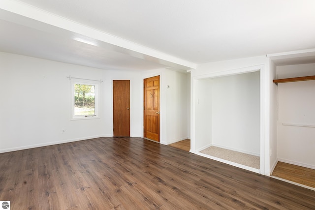 11199 Center Rd, Traverse City, MI 49686 - unfurnished room with dark wood-type flooring and baseboards