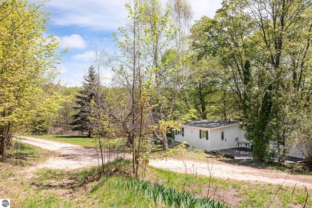 11199 Center Rd, Traverse City, MI 49686 - view of front facade with a forest view