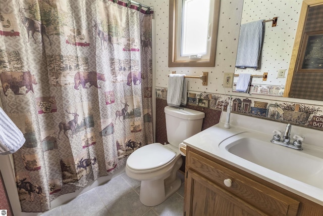 bathroom with tile patterned flooring, toilet, vanity, curtained shower, and wallpapered walls