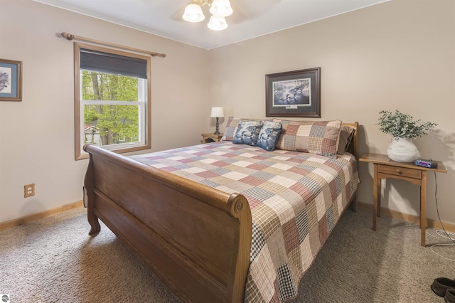 carpeted bedroom with baseboards and a ceiling fan