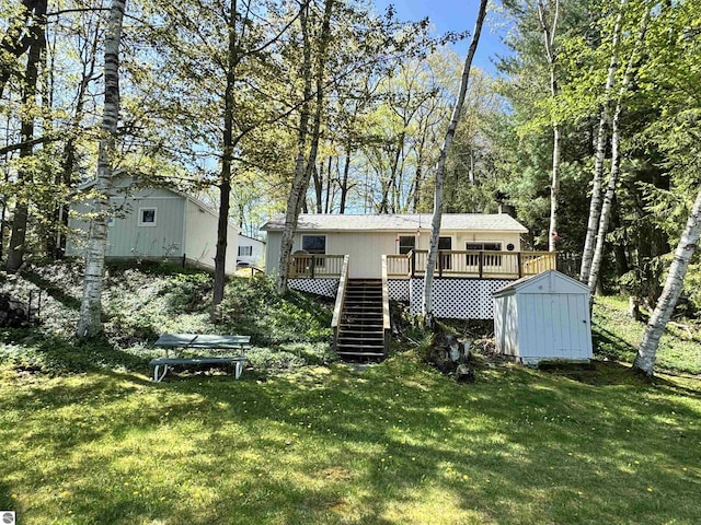 921 Pine St, Harrison, MI 48625 - rear view of property featuring stairs, a wooden deck, and a lawn