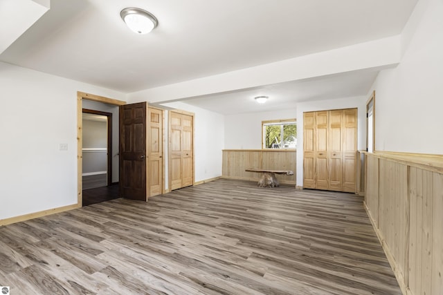 4267 Main St, Kingsley, MI 49649 - unfurnished bedroom featuring wood finished floors and baseboards
