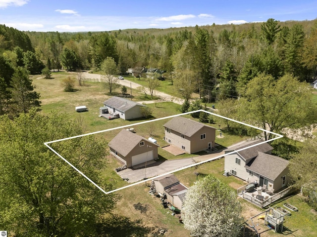 4267 Main St, Kingsley, MI 49649 - view from above of property featuring property parcel outlined and a heavily wooded area