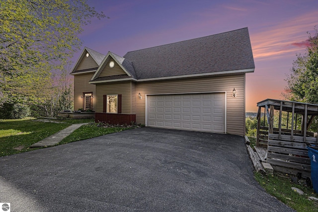 3290 Sumac Trl, Frankfort, MI 49635 - view of front of house with asphalt driveway and an attached garage