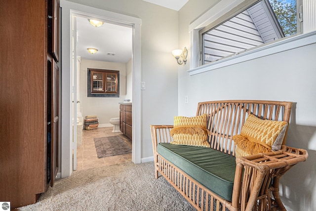 3290 Sumac Trl, Frankfort, MI 49635 - corridor featuring light colored carpet, baseboards, and light tile patterned flooring