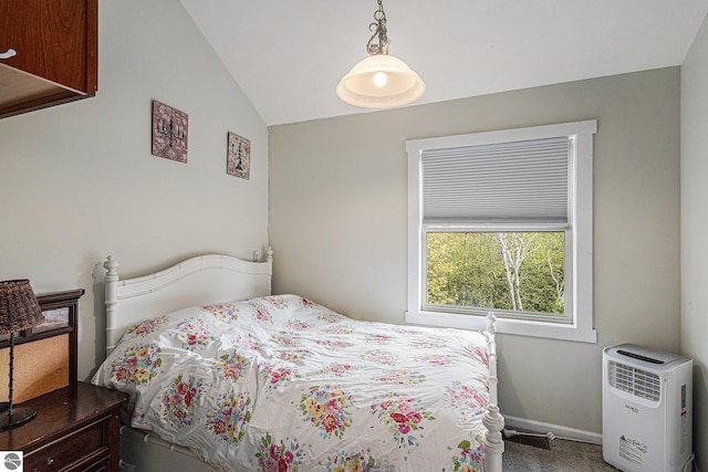 3290 Sumac Trl, Frankfort, MI 49635 - carpeted bedroom featuring lofted ceiling and baseboards