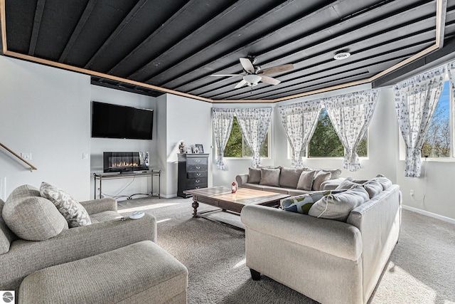 3290 Sumac Trl, Frankfort, MI 49635 - carpeted living area featuring ceiling fan and baseboards