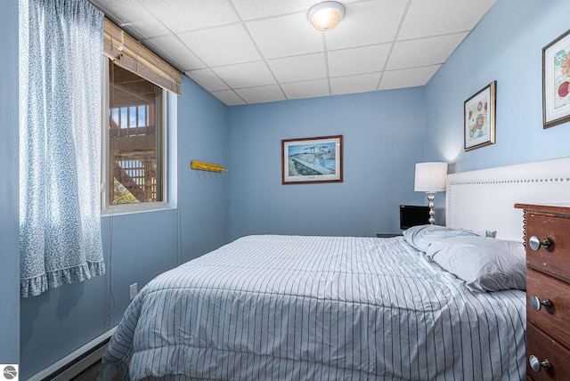 3290 Sumac Trl, Frankfort, MI 49635 - bedroom featuring a drop ceiling and baseboard heating