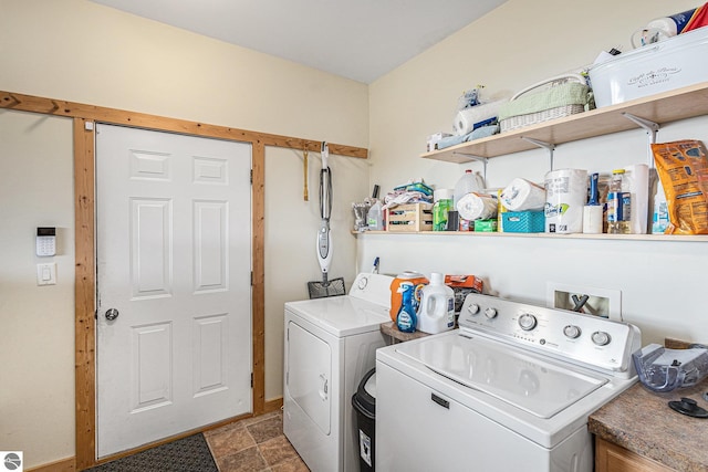 3290 Sumac Trl, Frankfort, MI 49635 - laundry area with washer and dryer, baseboards, and stone finish flooring