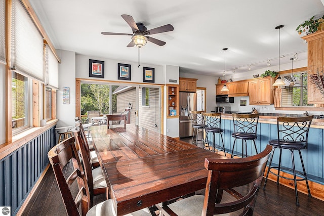 3290 Sumac Trl, Frankfort, MI 49635 - dining area featuring dark wood-style flooring and a ceiling fan
