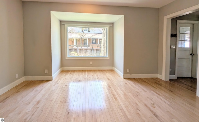 314 W Ninth St, Traverse City, MI 49684 - spare room with light wood-type flooring and baseboards