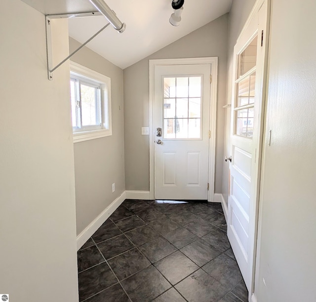 314 W Ninth St, Traverse City, MI 49684 - doorway with vaulted ceiling and baseboards