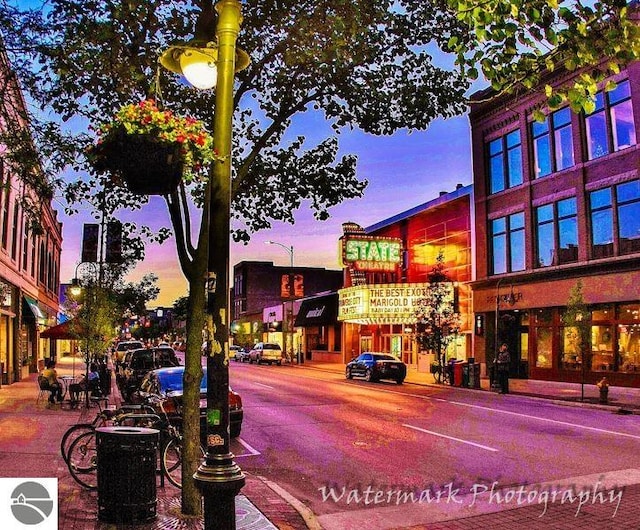 314 W Ninth St, Traverse City, MI 49684 - property at dusk featuring central AC unit