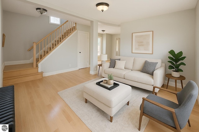 314 W Ninth St, Traverse City, MI 49684 - living room featuring stairs, wood finished floors, plenty of natural light, and baseboards