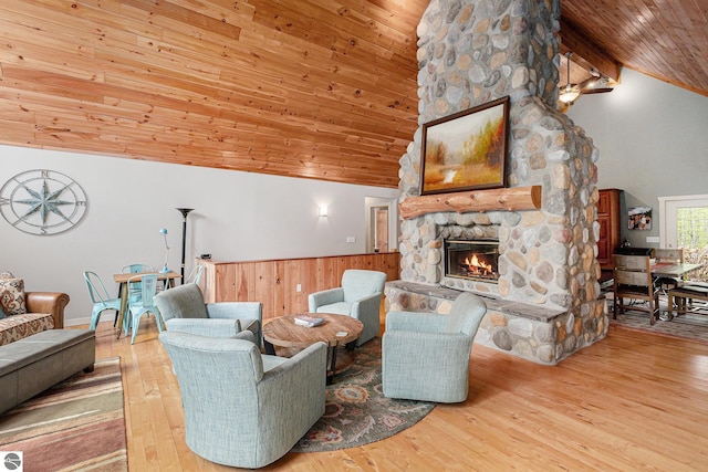 5301 Durga Rd, Williamsburg, MI 49690 - living room featuring wooden ceiling, a fireplace, wood finished floors, and high vaulted ceiling