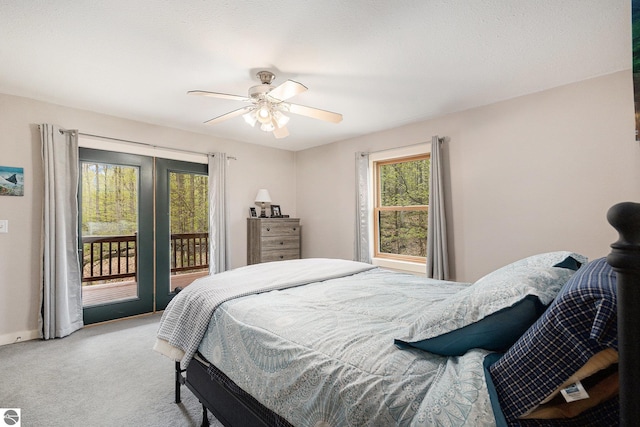 5301 Durga Rd, Williamsburg, MI 49690 - bedroom featuring access to outside, light carpet, a ceiling fan, and baseboards