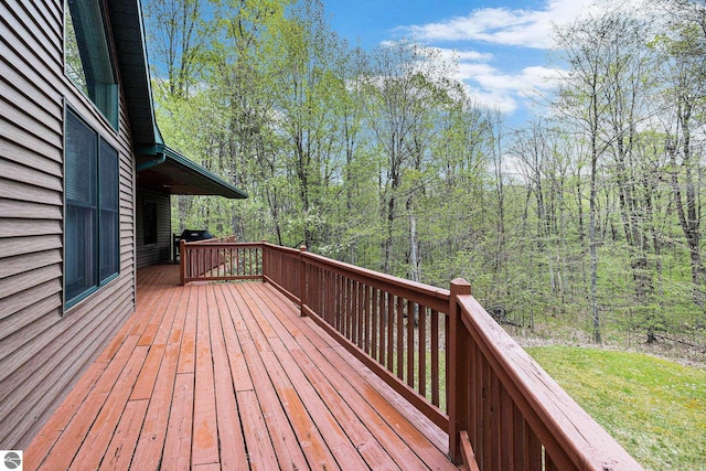 5301 Durga Rd, Williamsburg, MI 49690 - deck featuring a forest view