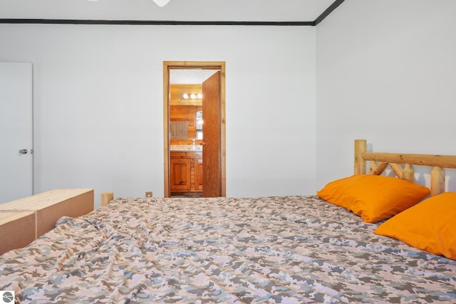 1493 NE Laura Ln, Kalkaska, MI 49646 - bedroom with crown molding and connected bathroom