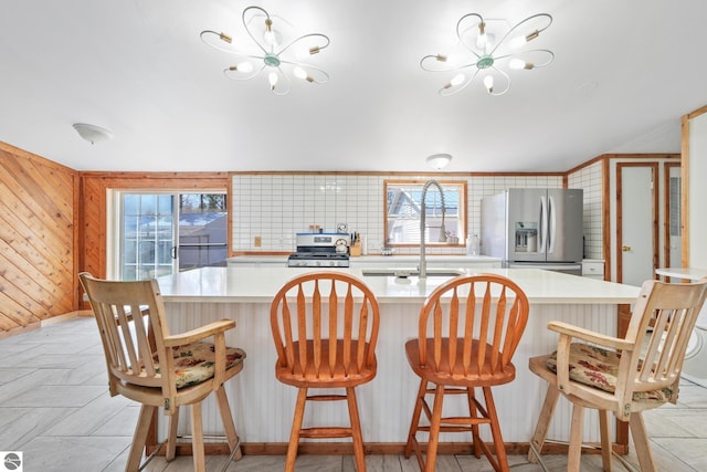 1493 NE Laura Ln, Kalkaska, MI 49646 - kitchen featuring stainless steel appliances, a chandelier, and healthy amount of natural light