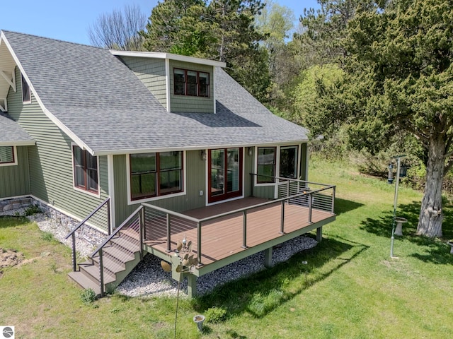 9560 S Cedar Rd, Cedar, MI 49621 - back of house with a shingled roof, a deck, and a yard