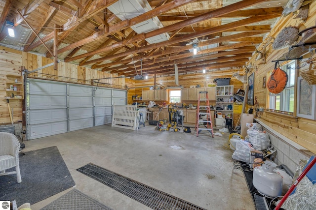 9560 S Cedar Rd, Cedar, MI 49621 - garage featuring wood walls