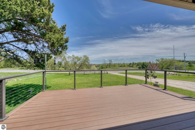 9560 S Cedar Rd, Cedar, MI 49621 - deck featuring a lawn