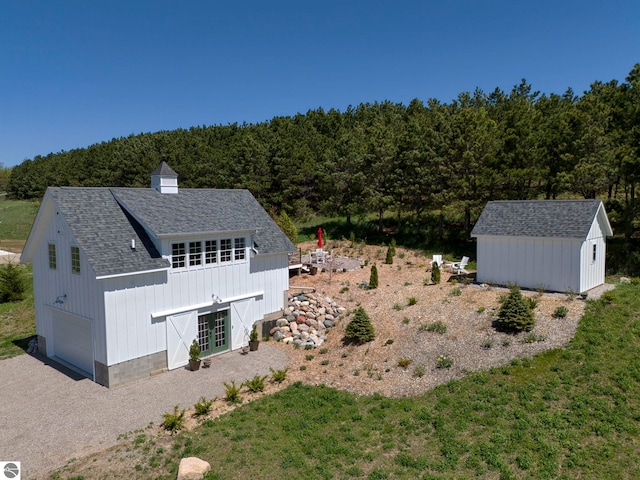 2494 N Setterbo Rd, Suttons Bay, MI 49682 - aerial view of property and surrounding area featuring a forest