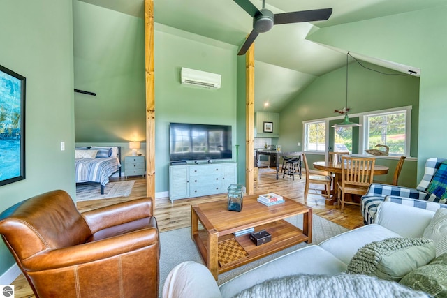 2494 N Setterbo Rd, Suttons Bay, MI 49682 - living room featuring wood finished floors, ceiling fan, a wall mounted air conditioner, baseboards, and high vaulted ceiling