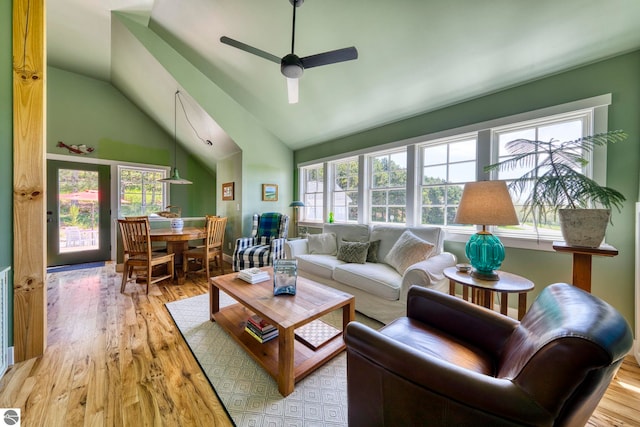 2494 N Setterbo Rd, Suttons Bay, MI 49682 - living area featuring a ceiling fan, light wood-type flooring, plenty of natural light, and high vaulted ceiling