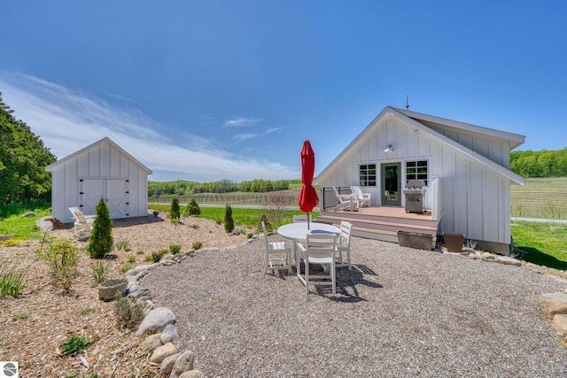2494 N Setterbo Rd, Suttons Bay, MI 49682 - view of yard with a wooden deck and outdoor dining area