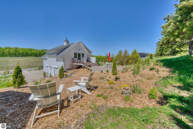 2494 N Setterbo Rd, Suttons Bay, MI 49682 - view of yard featuring a wooden deck