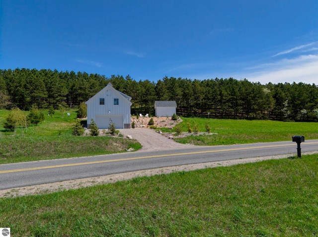 2494 N Setterbo Rd, Suttons Bay, MI 49682 - view of street featuring a wooded view