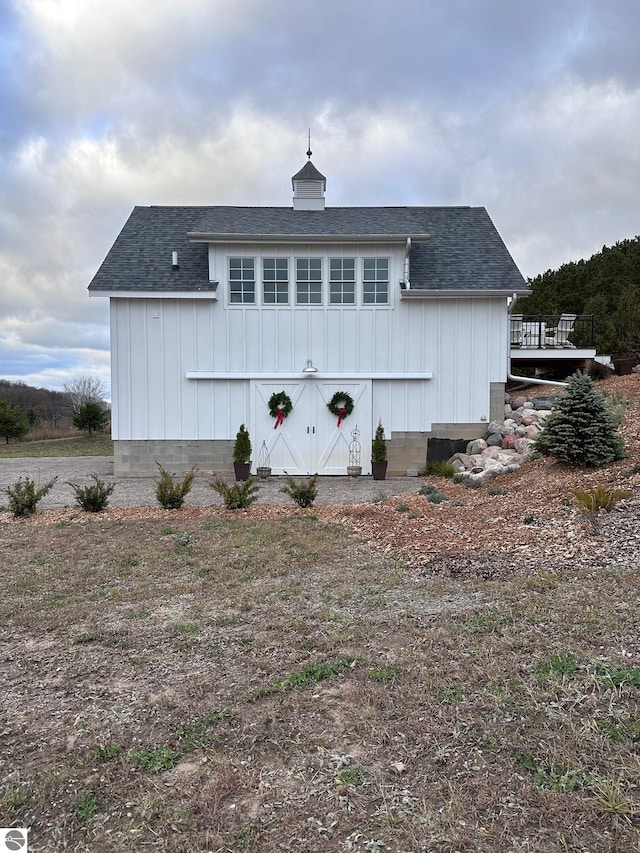 2494 N Setterbo Rd, Suttons Bay, MI 49682 - view of front facade featuring roof with shingles