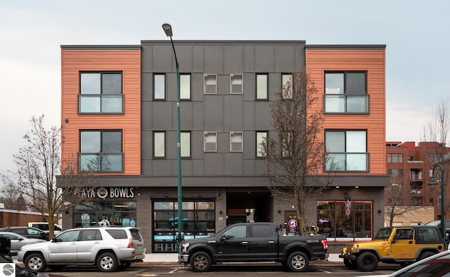 222 E State St Unit 303, Traverse City, MI 49684 - view of property featuring uncovered parking